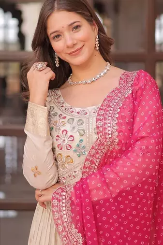 Off-white jacquard gown with pink dupatta