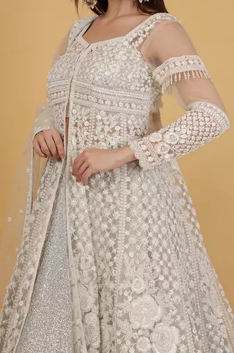 white and silver lehenga set with jacket