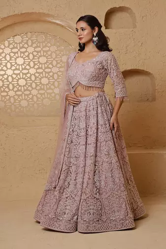 dull pink net lehenga set with with blouse and dupatta
