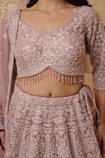 dull pink net lehenga set with with blouse and dupatta