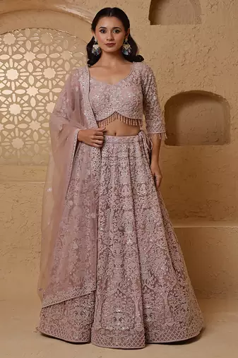 dull pink net lehenga set with with blouse and dupatta