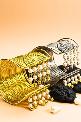 combo of two gold & silver-plated pearl hanging balls  adjustable cuff bracelets