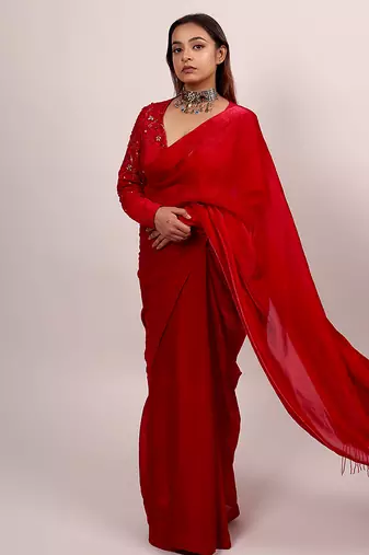 Red embroidered crepe saree