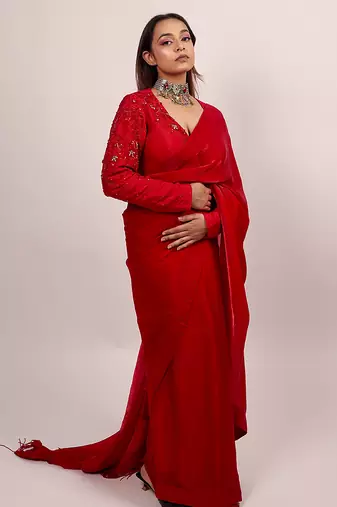 Red embroidered crepe saree