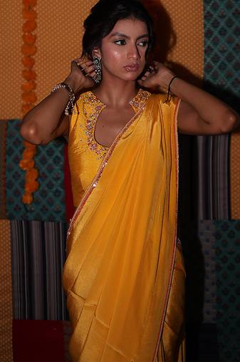 Yellow embroidered crepe saree