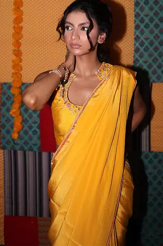 Yellow embroidered crepe saree