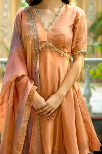 Peach tissue lace wrok kurta and sharara and dupatta set