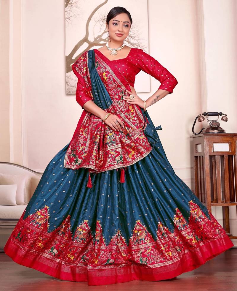 teal-blue patola print dola silk lehenga set with choli and dupatta with tassels