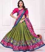 green patola print dola silk lehenga set with choli and dupatta with tassels