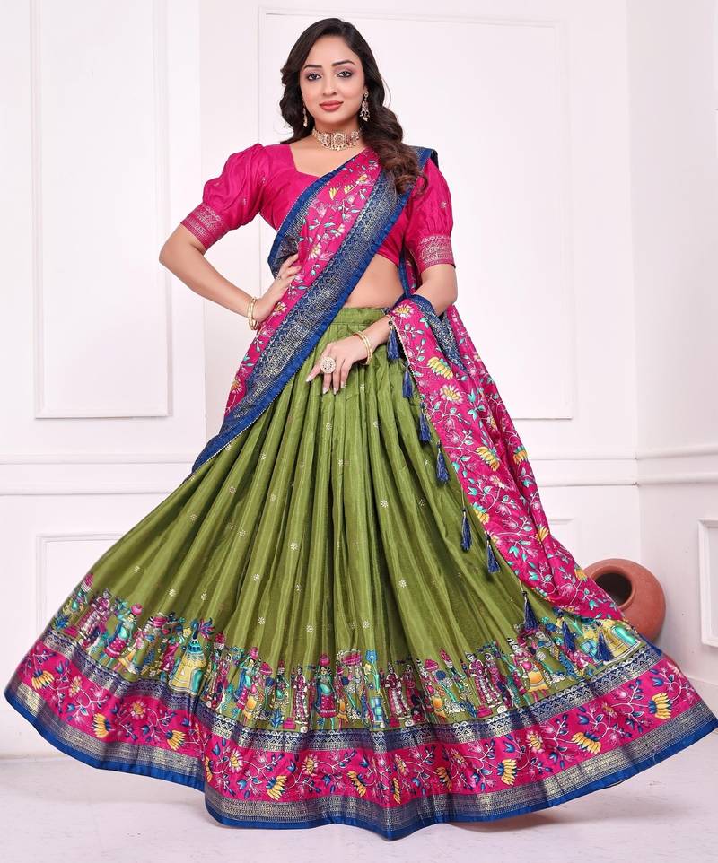 green patola print dola silk lehenga set with choli and dupatta with tassels