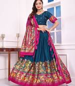 teal-blue patola print dola silk lehenga set with choli and dupatta with tassels