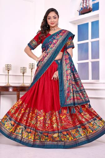 red patola print dola silk lehenga set with choli and dupatta with tassels