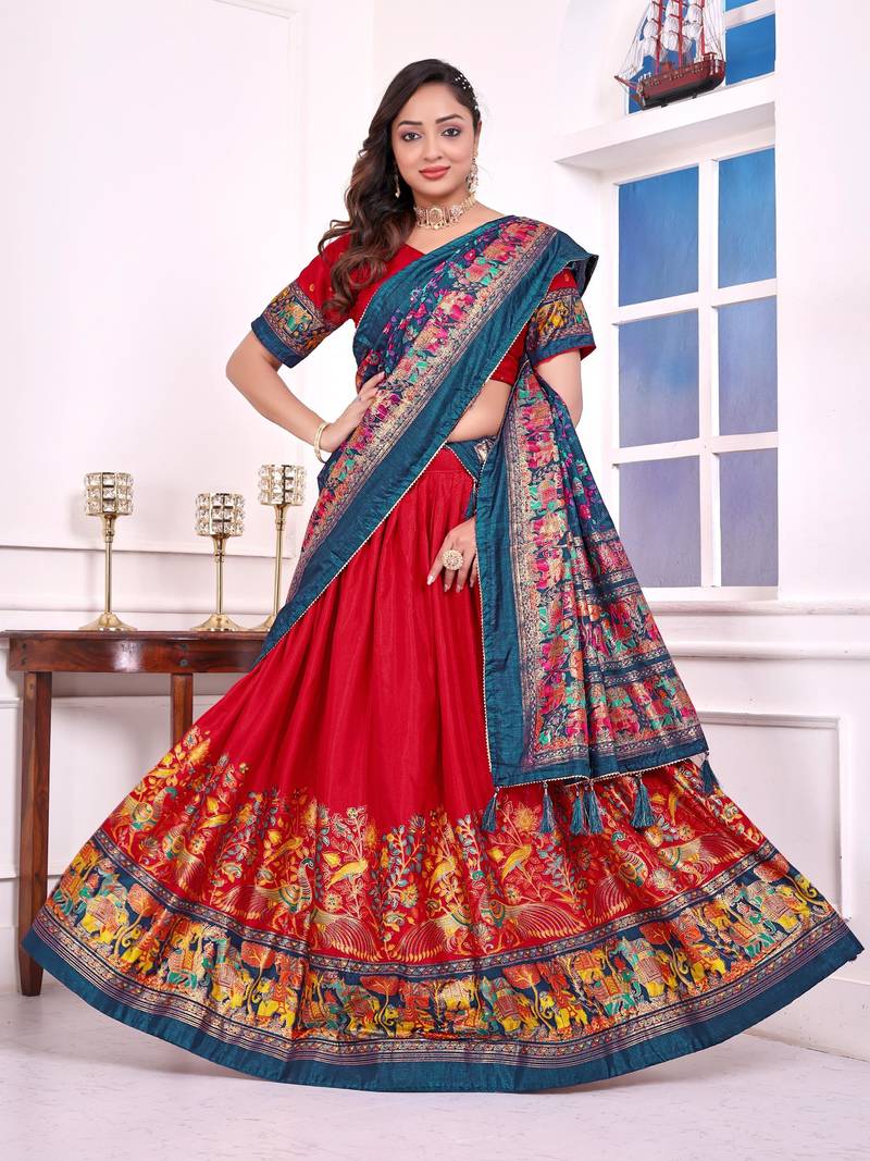 red patola print dola silk lehenga set with choli and dupatta with tassels