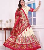 beige patola print dola silk lehenga set with choli and dupatta with tassels
