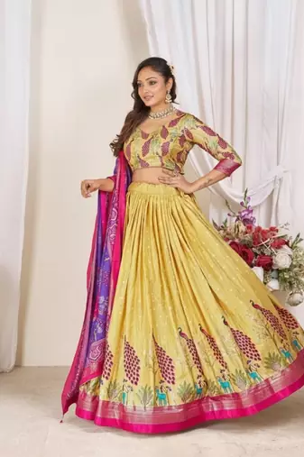 yellow patola print dola silk lehenga set with choli and dupatta with tassels