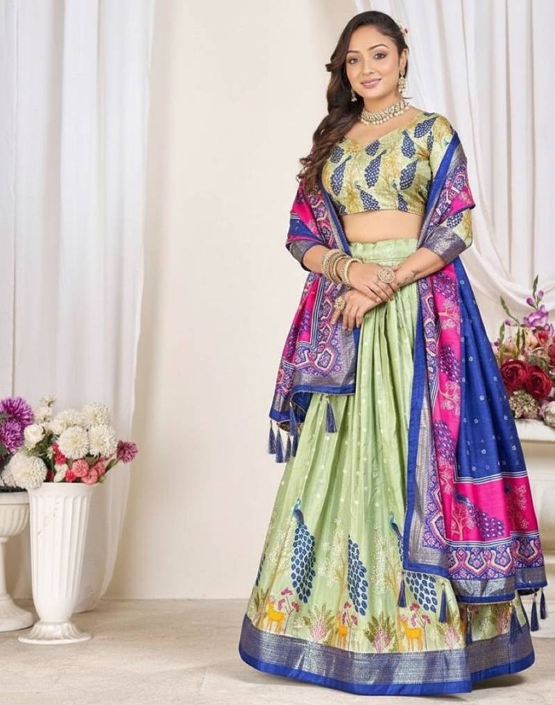 green patola print dola silk lehenga set with choli and dupatta with tassels