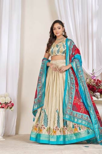 Cream patola print dola silk semi stitched lehenga choli with tassels