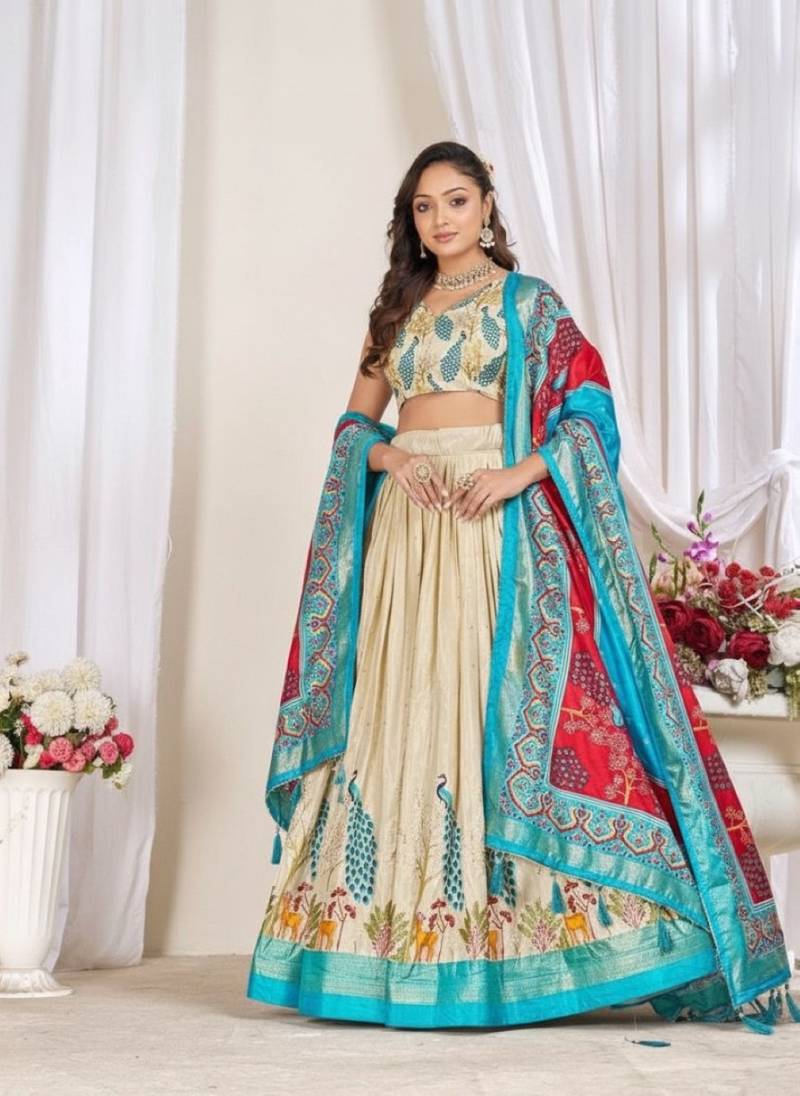 Cream patola print dola silk semi stitched lehenga choli with tassels