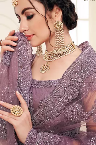 lavender heavy butterfly net embroidered wedding wear lehenga with choli and dupatta