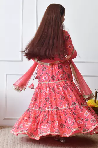 Girls peach printed lehenga choli set with embroidered yoke and dupatta