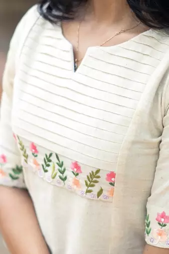 white embroidered cotton kurta and pant