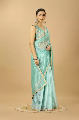 sea green net saree with embroidered blouse