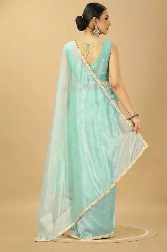 sea green net saree with embroidered blouse