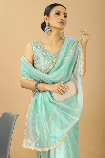 sea green net saree with embroidered blouse