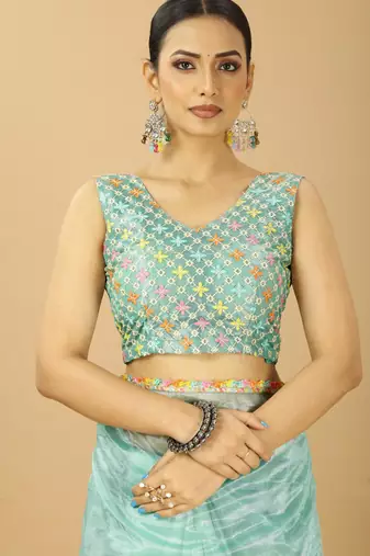 sea green net saree with embroidered blouse