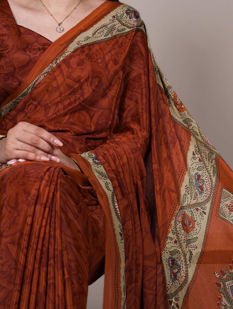 orange printed crepe saree with matching blouse