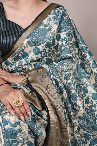 sea blue printed tasar art silk blend saree with shimmering viscose border