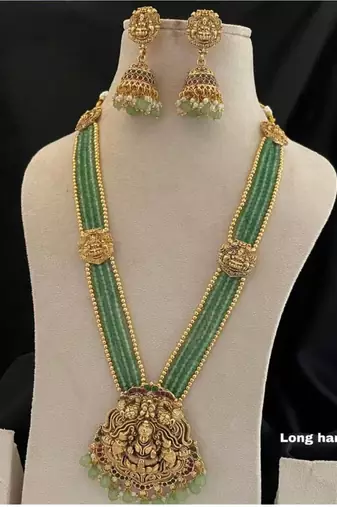 Antique gold-plated lakshmi long haram set with green beads & jhumkas     traditional temple jewelry