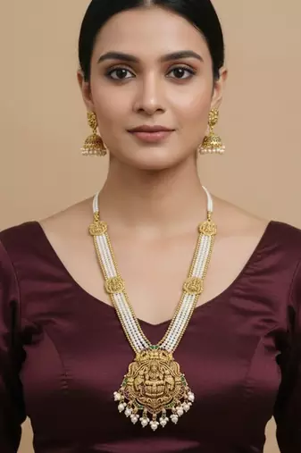 Antique gold-plated lakshmi long haram set with white beads & jhumkas     traditional temple jewelry