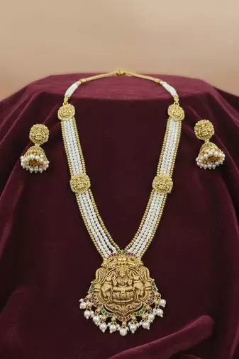 Antique gold-plated lakshmi long haram set with white beads & jhumkas     traditional temple jewelry