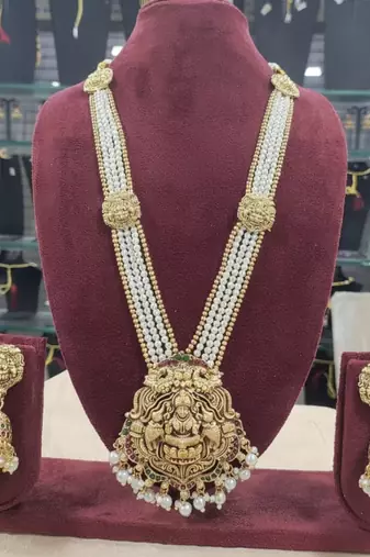 Antique gold-plated lakshmi long haram set with white beads & jhumkas     traditional temple jewelry