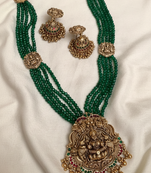 Antique gold-plated lakshmi long haram set with green beads & jhumkas – traditional temple jewelry