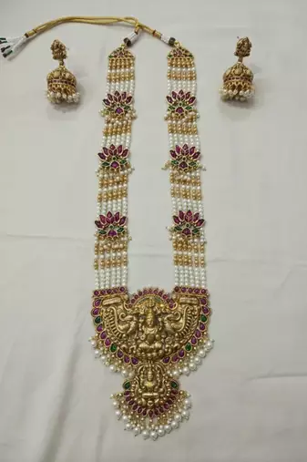 Traditional lakshmi temple long haram necklace set for women | gold-plated pearl, ruby & green stone bridal jewellery
