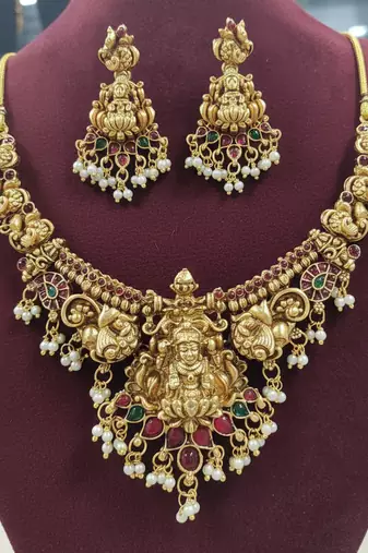 Antique gold-plated lakshmi temple necklace set with pearls & ruby green stones for women