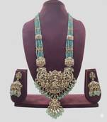 Antique gold-plated temple lakshmi haram necklace set with green beads & jhumka earrings