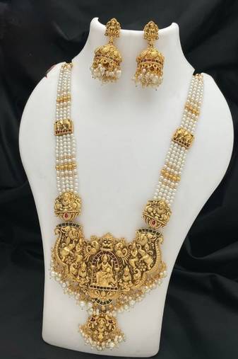Antique gold-plated temple lakshmi haram necklace set with white beads & jhumka earrings