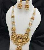 Antique gold-plated temple lakshmi haram necklace set with white beads & jhumka earrings