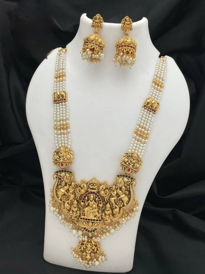 Antique gold-plated temple lakshmi haram necklace set with white beads & jhumka earrings