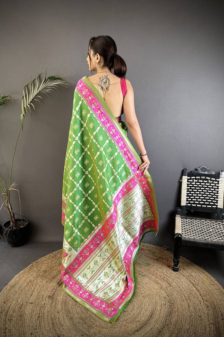 parrot green banarasi silk blend nature motifs zari weaving patola saree