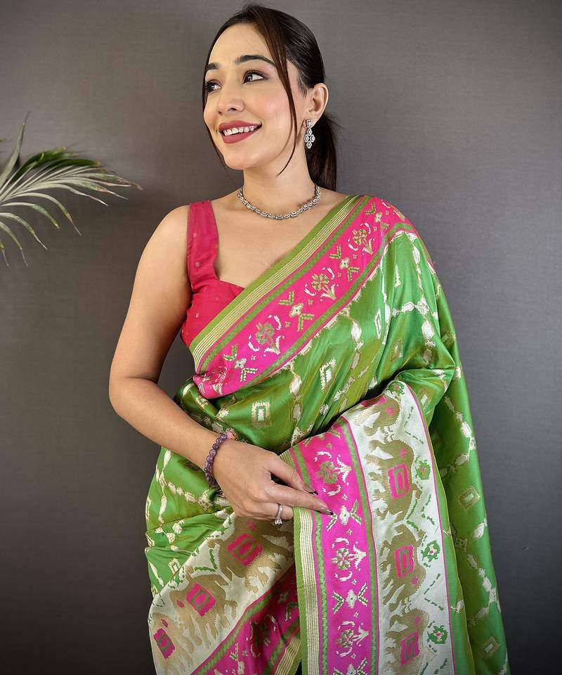 parrot green banarasi silk blend nature motifs zari weaving patola saree