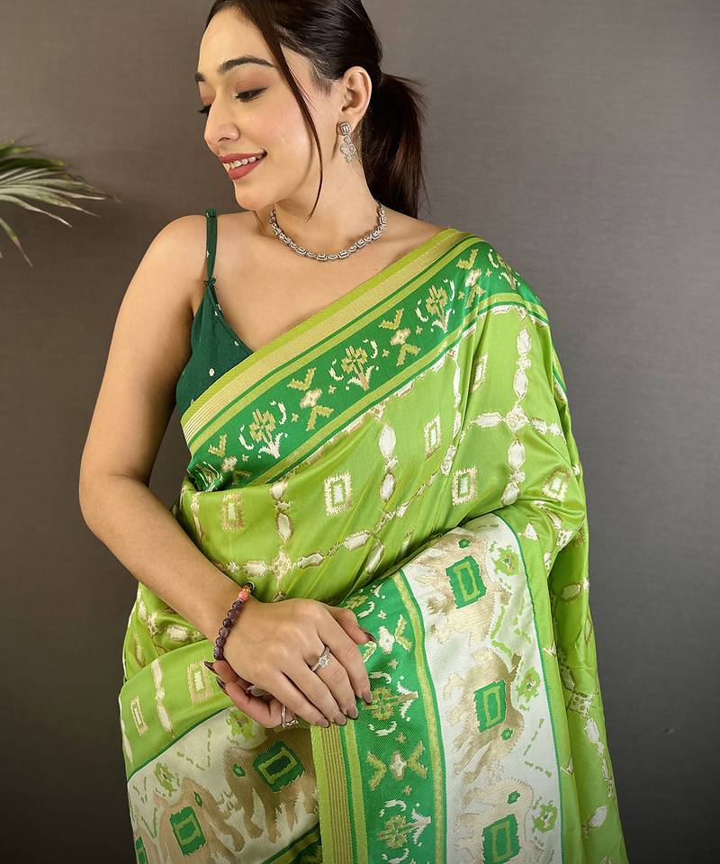 pear green banarasi silk blend nature motifs zari weaving patola saree
