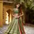Green batik printed dola silk lehenga choli & dupatta