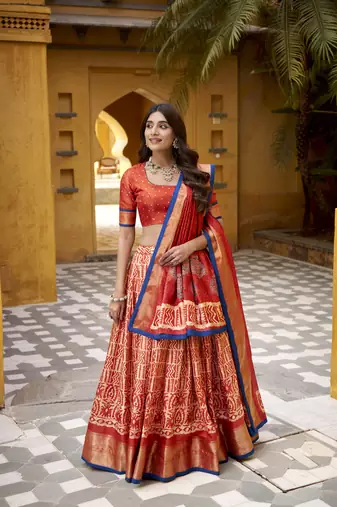 Orange Batik Printed Dola Silk Lehenga Choli & Dupatta