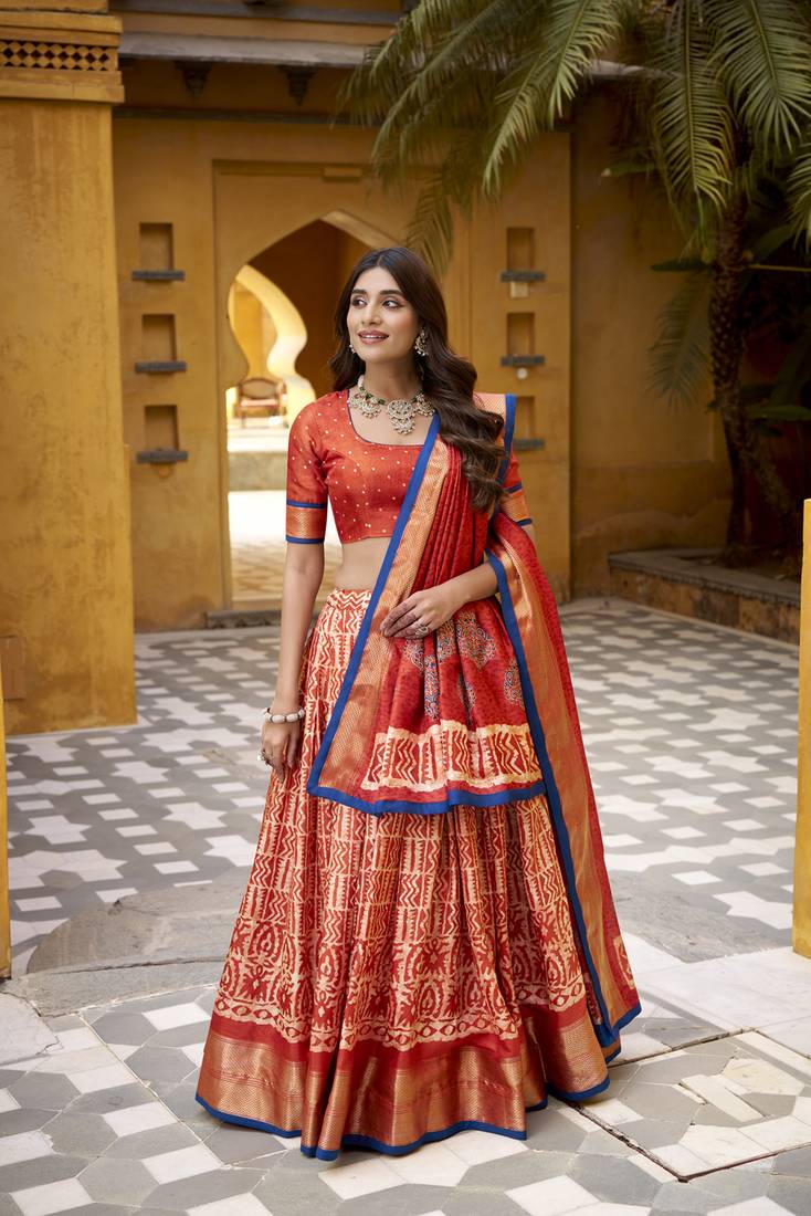 Orange Batik Printed Dola Silk Lehenga Choli & Dupatta