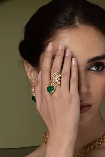 Gold plated kundan green stones ring