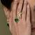 Gold plated kundan green stones ring